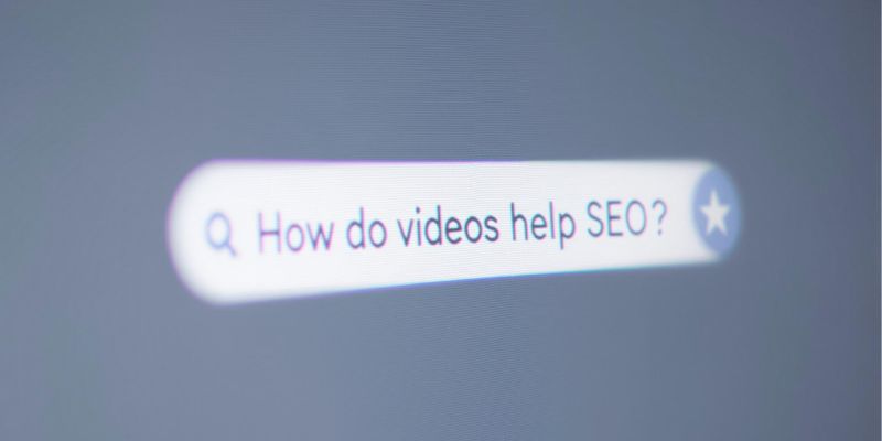 Search bar displaying the query 'How do videos help SEO?' on a blurred gray background.